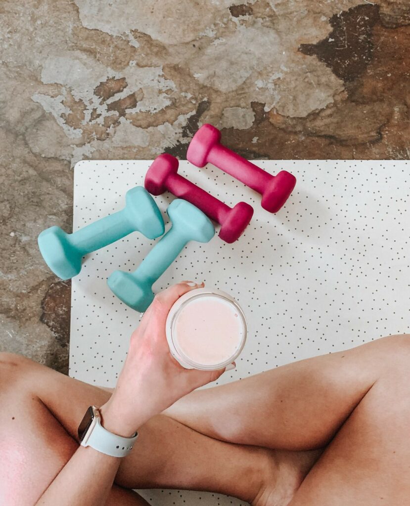 fit woman drinking infused water